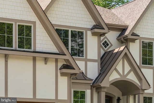 9005 Ridge Ln, Vienna, VA 22182 - view of home's exterior featuring a shingled roof and stucco siding