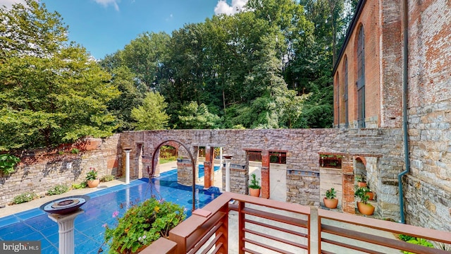 view of swimming pool with a patio