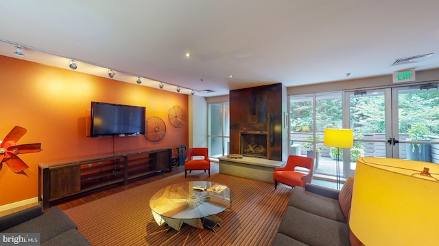 living room featuring a fireplace and wood-type flooring