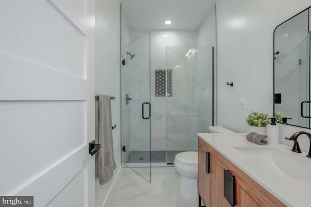 bathroom with toilet, recessed lighting, vanity, marble finish floor, and a marble finish shower