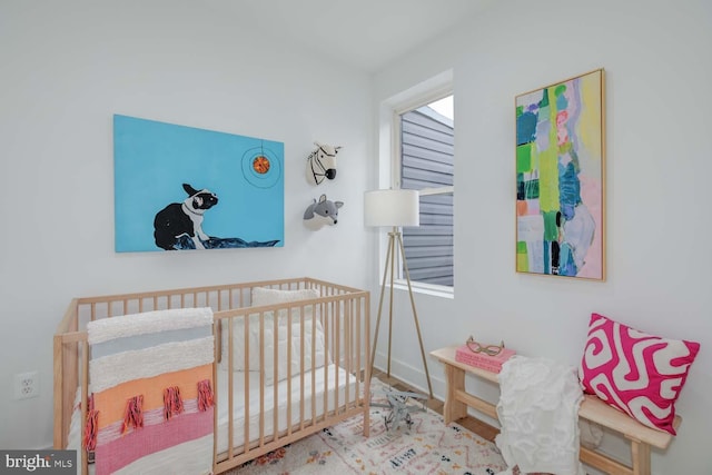 bedroom with a nursery area