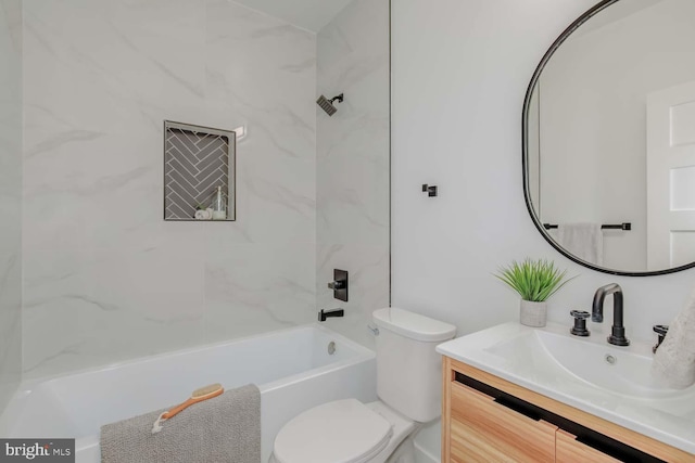 bathroom featuring toilet, shower / tub combination, and vanity