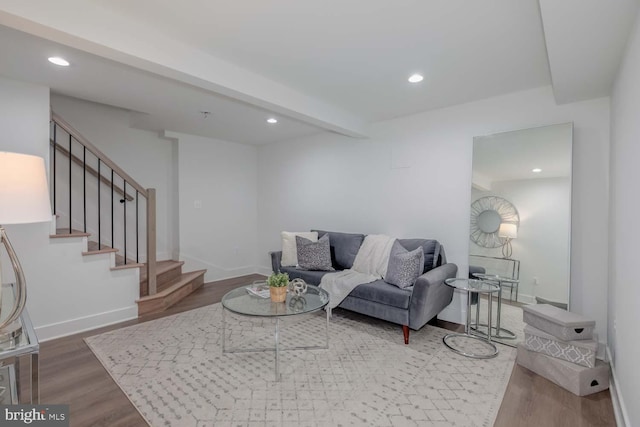 living room with beamed ceiling, stairway, wood finished floors, and recessed lighting