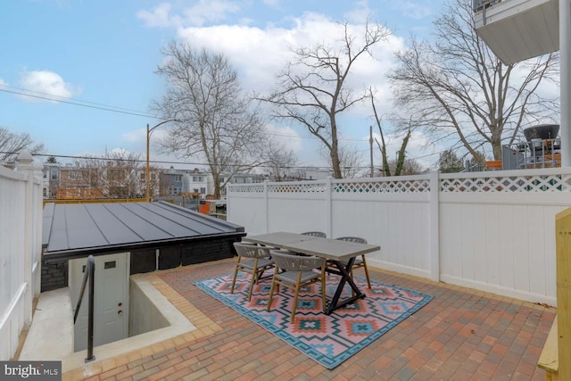 view of patio / terrace featuring outdoor dining space and fence