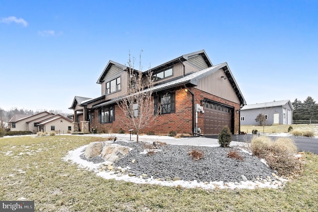 view of front of home with a garage and a front yard