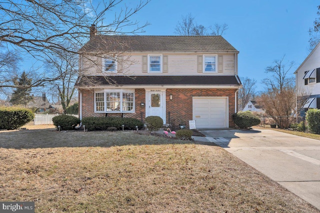 view of front of house featuring a garage and a front yard