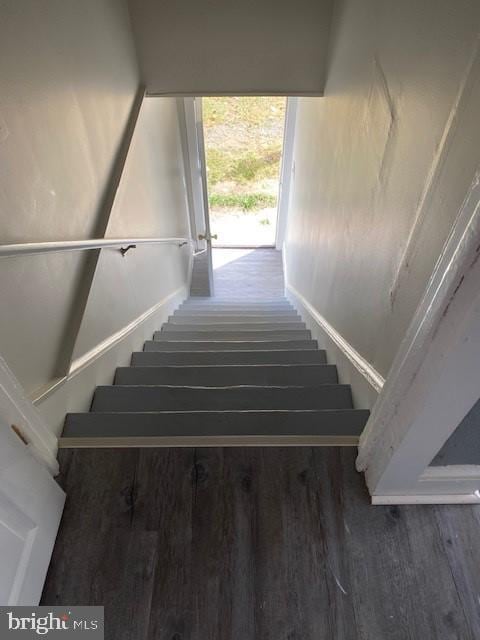 stairway featuring hardwood / wood-style flooring