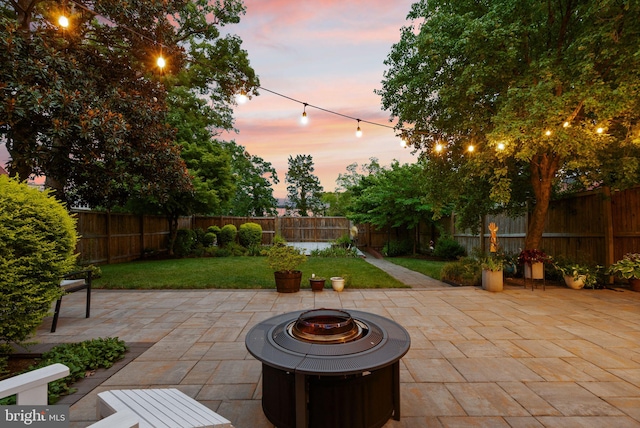 view of patio with an outdoor fire pit