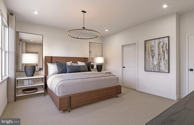 bedroom with baseboards, light colored carpet, and recessed lighting