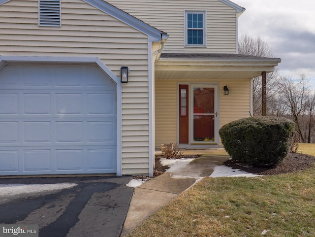 property entrance with a garage and a porch