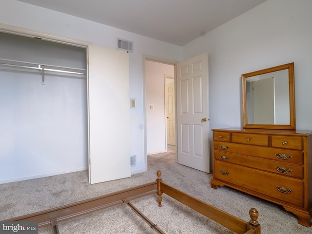 bedroom with carpet and a closet