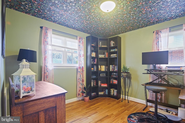 office space featuring light wood finished floors and baseboards