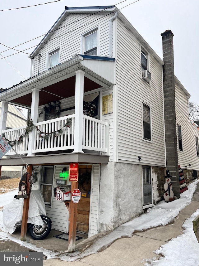 view of home's exterior with a balcony