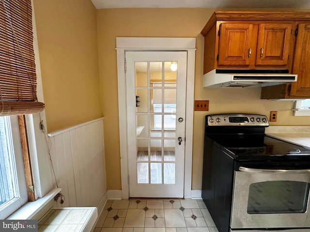 interior space with a wainscoted wall