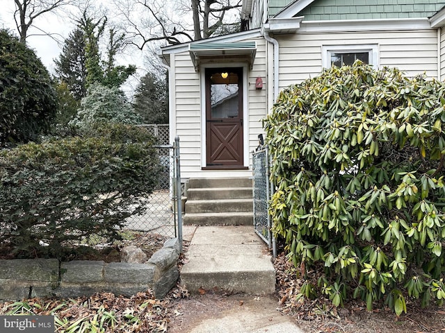 doorway to property with fence