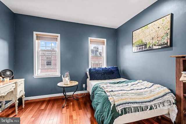 bedroom with wood-type flooring