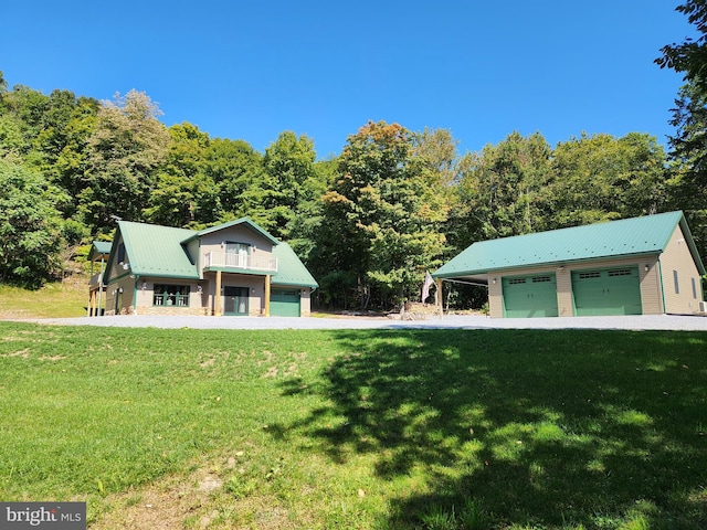 view of front of house with a front yard and metal roof