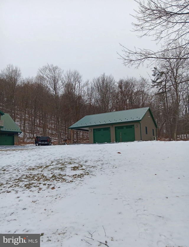 exterior space featuring a detached garage