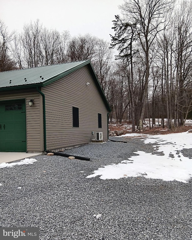 view of property exterior featuring metal roof