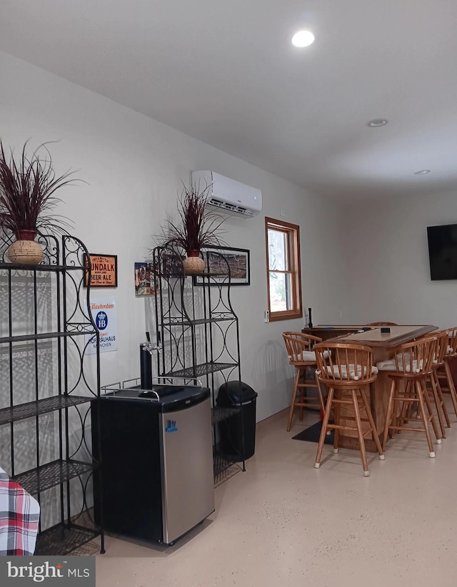 dining area featuring recessed lighting, a wall unit AC, and a bar