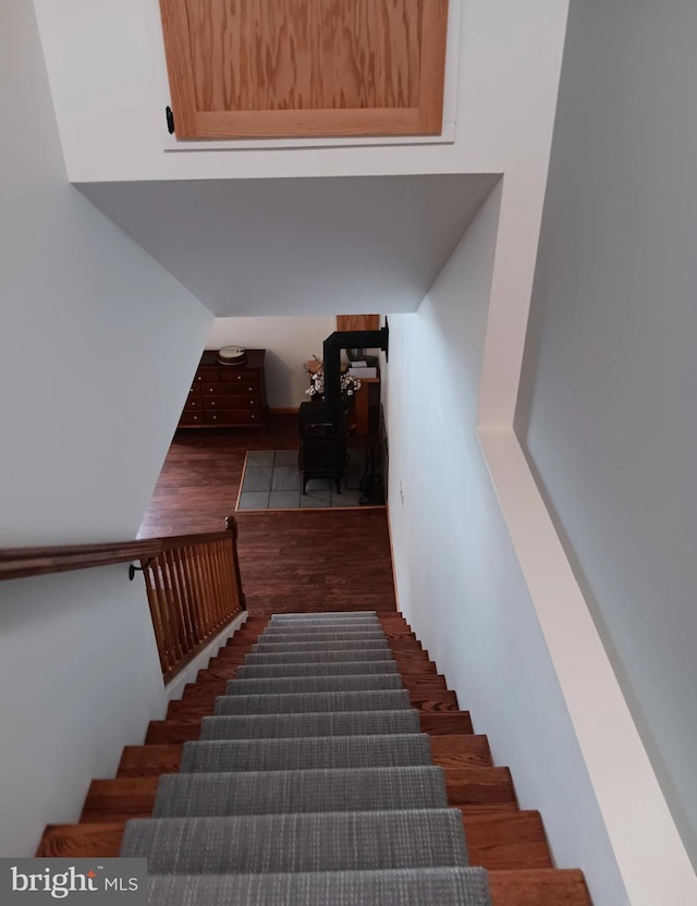 stairway featuring wood finished floors