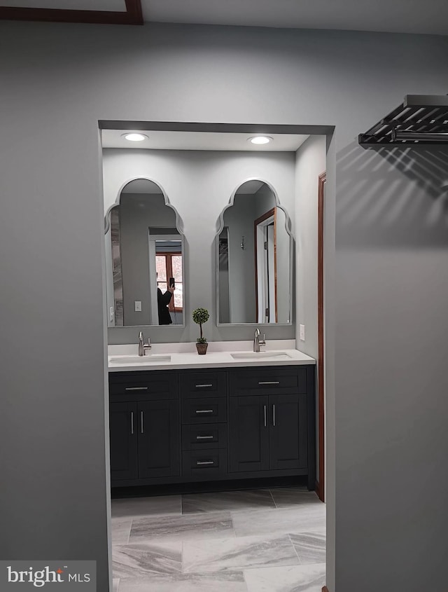 bathroom with double vanity and a sink