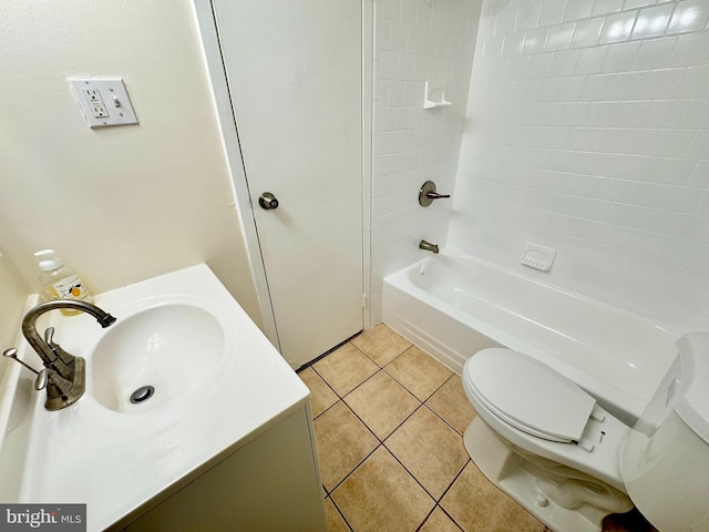 bathroom with tile patterned flooring, shower / washtub combination, toilet, and vanity