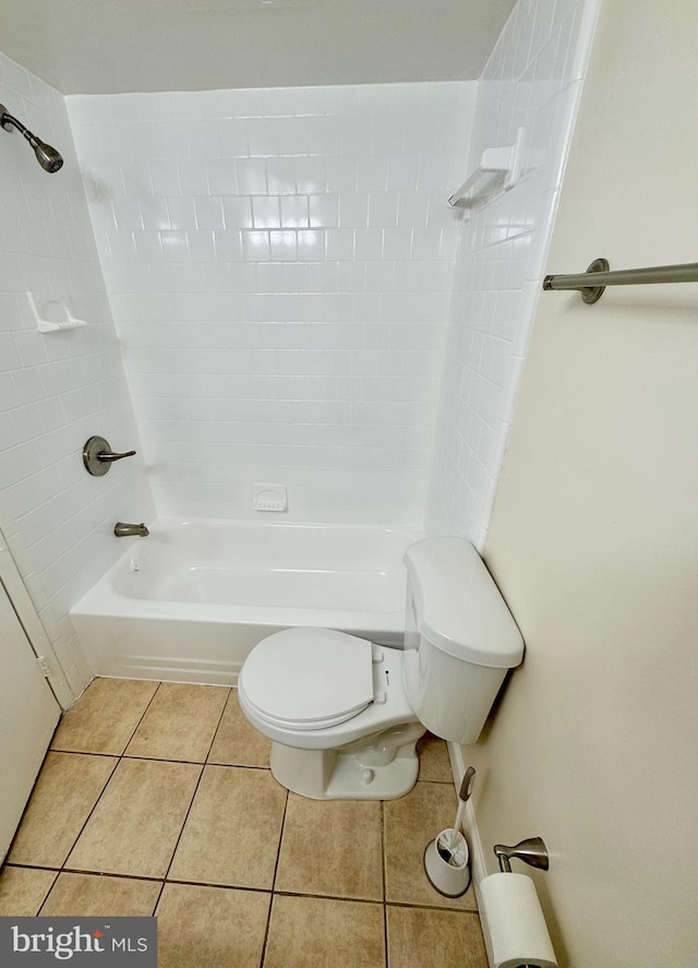 full bathroom featuring tile patterned floors, toilet, and bathtub / shower combination