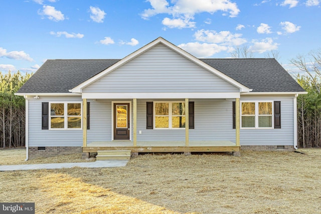 view of front of home featuring covered porch and a front yard