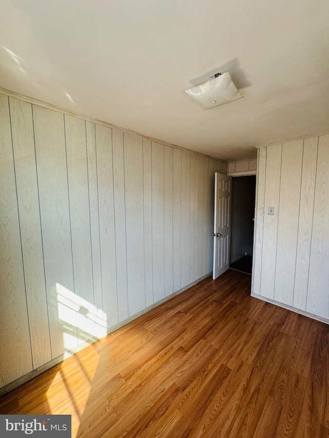 unfurnished room featuring wood finished floors