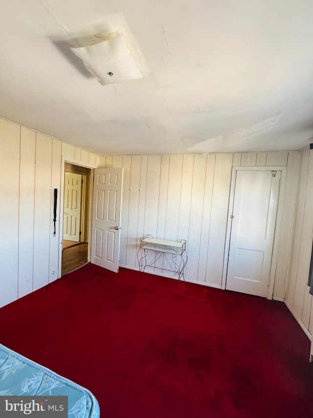 unfurnished bedroom with carpet flooring