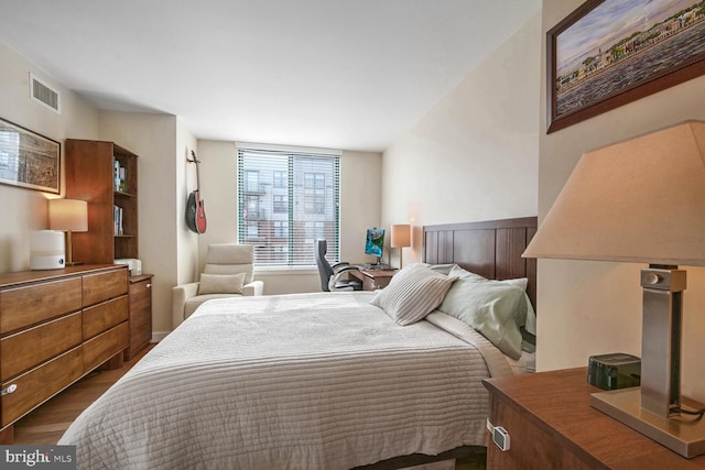 bedroom featuring dark hardwood / wood-style flooring