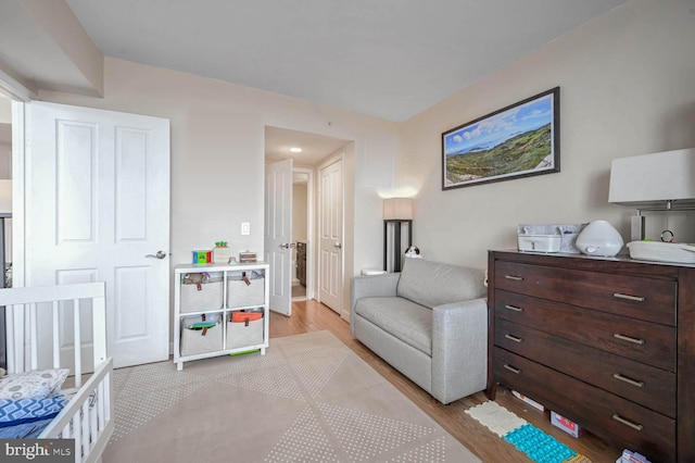 bedroom with light wood-type flooring