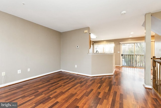 spare room featuring dark hardwood / wood-style flooring