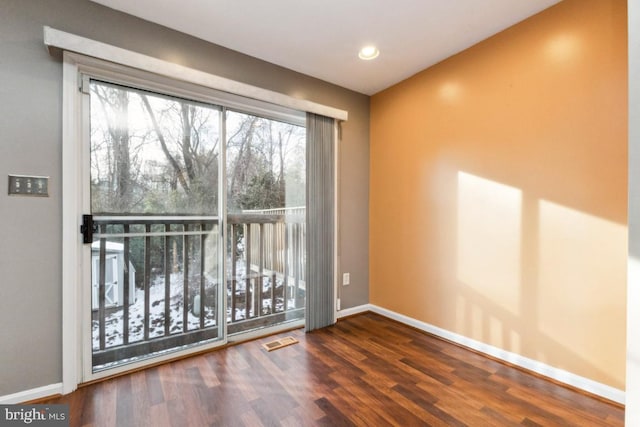 unfurnished room with dark hardwood / wood-style floors