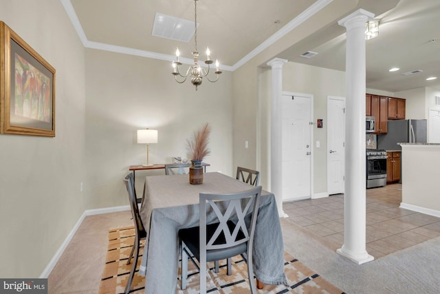 dining space featuring light colored carpet, ornate columns, and ornamental molding