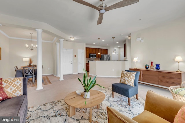 living room featuring light carpet, ornate columns, and ceiling fan with notable chandelier