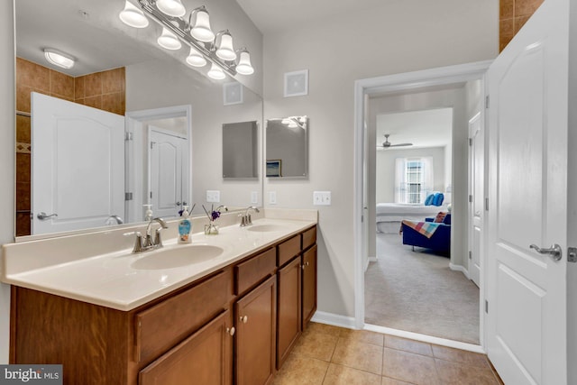 bathroom with tile patterned floors, ceiling fan, and vanity