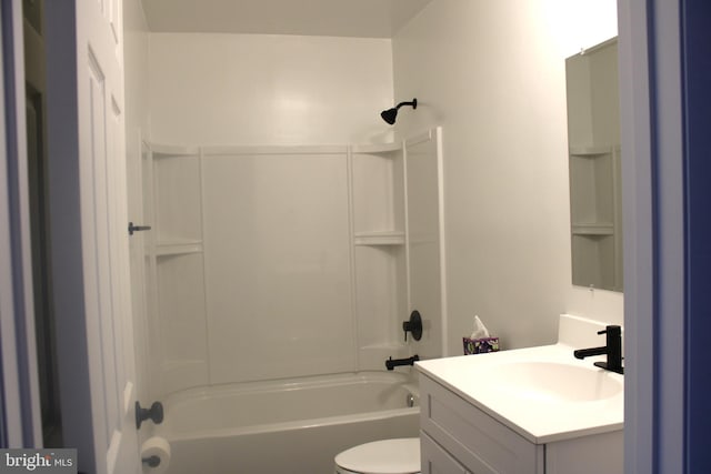 bathroom with toilet, vanity, and bathing tub / shower combination