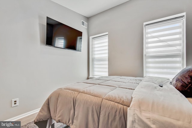 bedroom featuring wood-type flooring