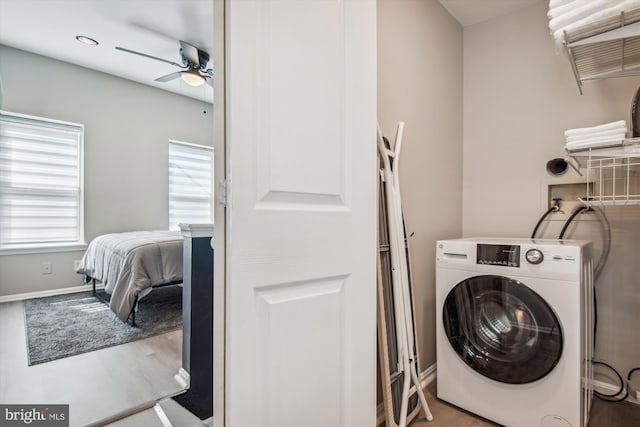 laundry room featuring ceiling fan, wood-type flooring, and washer / clothes dryer