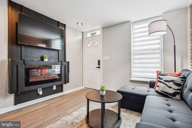 living room with a wealth of natural light and light wood-type flooring