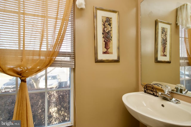 bathroom featuring a sink and a healthy amount of sunlight