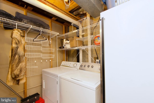 laundry area with laundry area and washing machine and clothes dryer