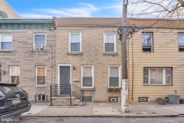 townhome / multi-family property with stone siding