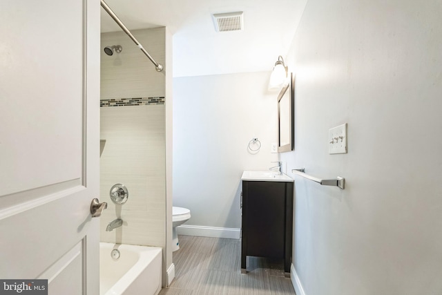 bathroom featuring visible vents, toilet, vanity,  shower combination, and baseboards