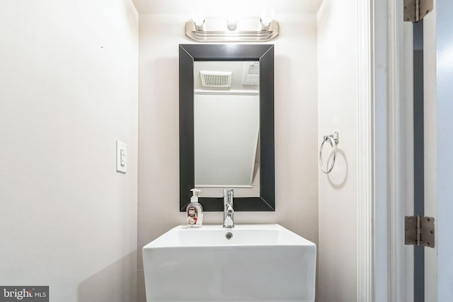 bathroom featuring a sink and visible vents