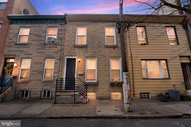 townhome / multi-family property with stone siding