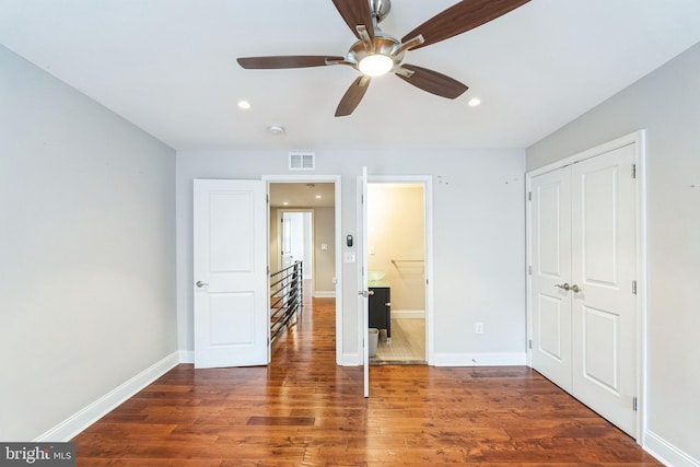 unfurnished bedroom featuring recessed lighting, visible vents, baseboards, and wood finished floors