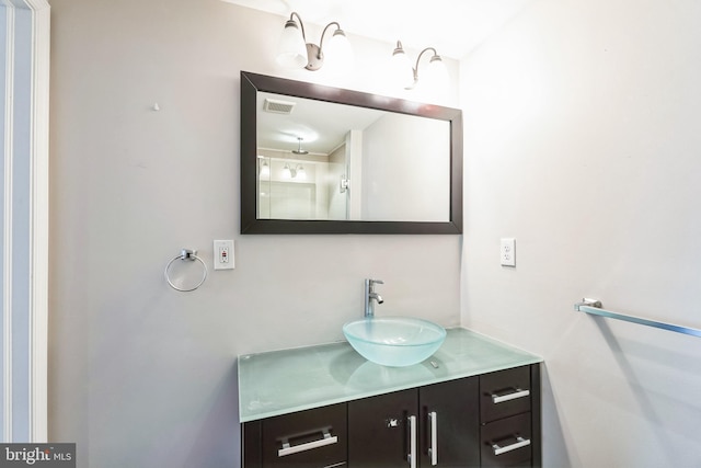 bathroom with visible vents and vanity